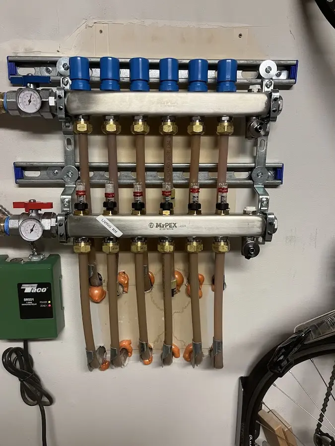 Plumber performing Water Heater Repair at a residential property in Walpole